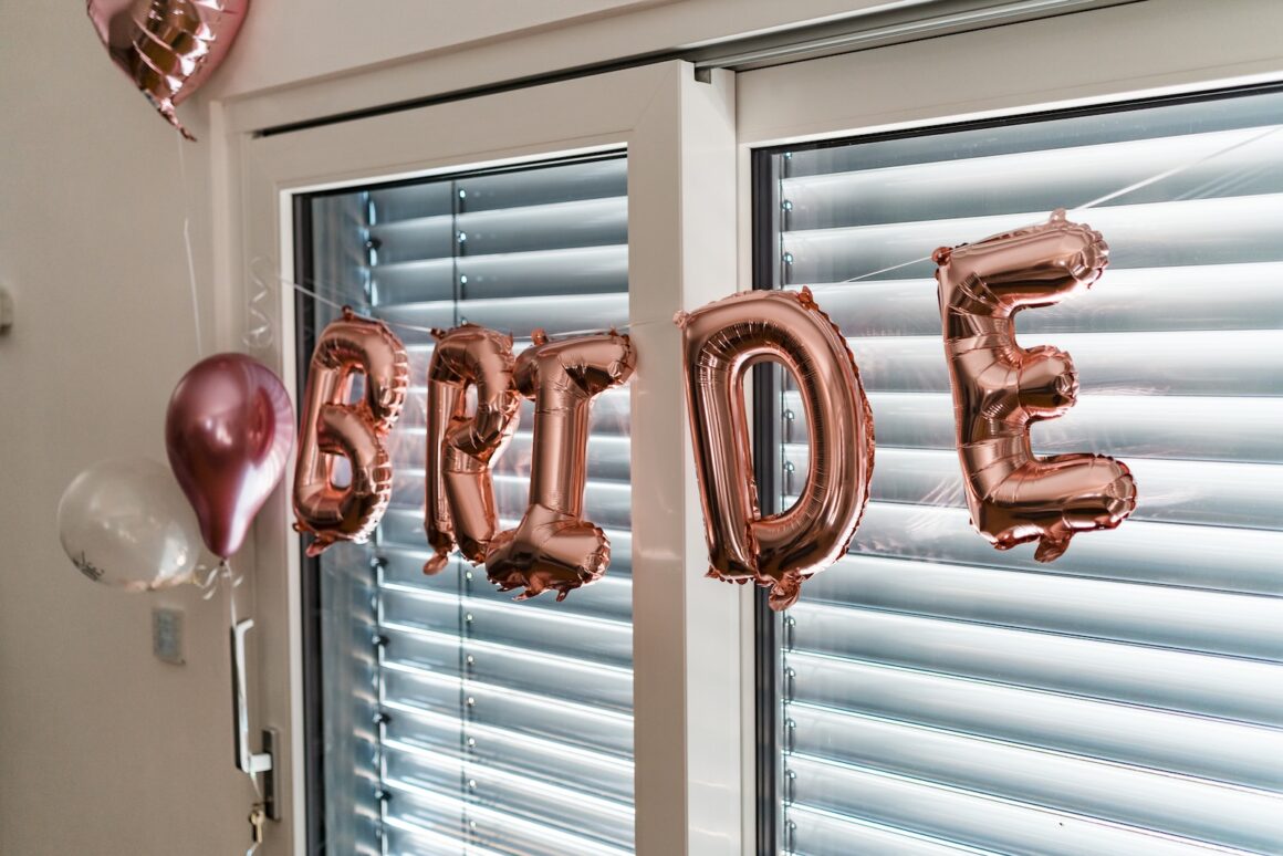 a balloon that says happy birthday hanging from a window - JGA Ideen mylocalwedding